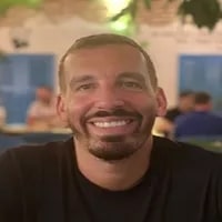 Jarir_Mallah seen posing for a photo at a office space